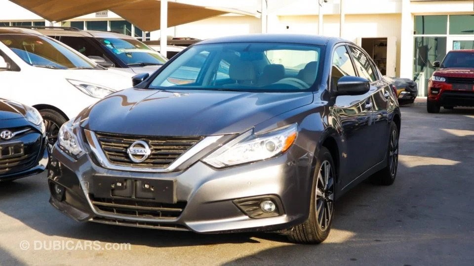 Front right photograph of a grey Nissan Altima; an example of how to sell a car in Dubai with high-quality photographs of the used car for sale.