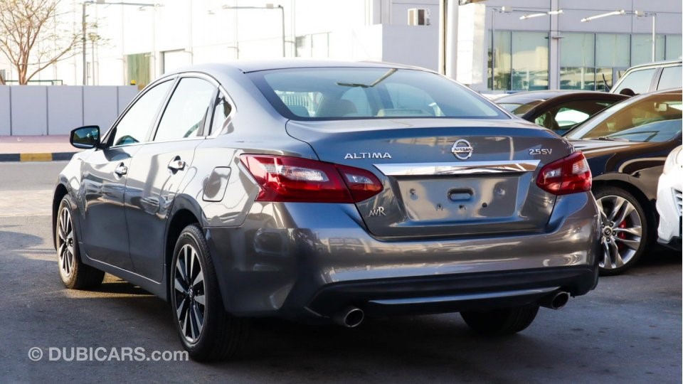 Rear left view of a grey Nissan Altima for sale in Dubai; an example of how to sell a car in Dubai with high-quality photographs of different angles of the vehicle.