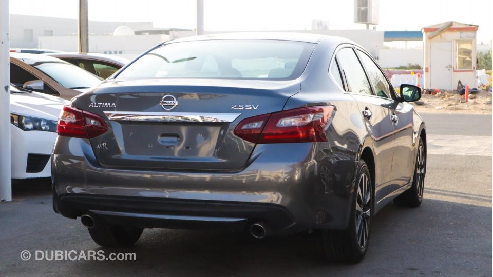 Rear right view of a grey Nissan Altima for sale in Dubai, showcasing how to sell a car in Dubai on the internet with high-quality photographs of different angles of the vehicle.