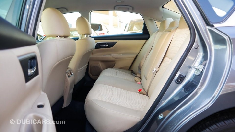View of the rear interior of a grey Nissan Altima for private sale in Dubai; an example of how to sell a car in Dubai on the internet with quality photography of different parts of the vehicle for sale.